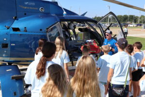 Healing Hands Summer Camp Students Touring a medical Helicopter