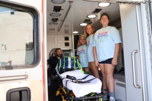 Healing Hands Summer Camp Students Touring an Ambulance