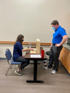 Occupational Therapist performing Hand Therapy with a Career Explorer Student