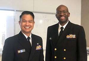 Commander Adams Solola (right) and Lieutenant Eric Mangahis in their USPHS uniforms.