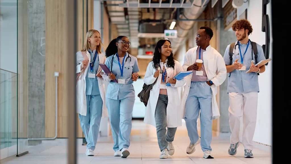 Scholars walking down a hallway