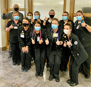 Rend Lake College nursing students pose together in their scrubs, masks and stethoscopes.