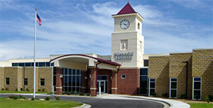 Main entrance to Memorial Hospital on a sunny day.