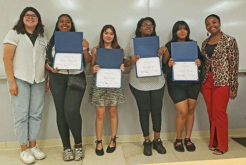 Instructor Anna Yankelev and Ronisha Edwards-Elliot with some of the course completers.