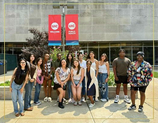 2024 class of Chicago AHEC's CHW Youth Pathway program poses in front of the School of Public Health.