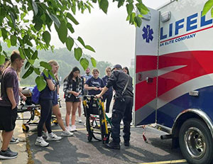 Rural Health Careers Campers learn about emergency medicine from an ambulance crew.