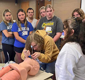 Rural Health Careers Campers learn to do intubation.