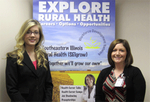 Participants stand before a poster that says Explore Rural Health: Careers. Options. Opportunities.