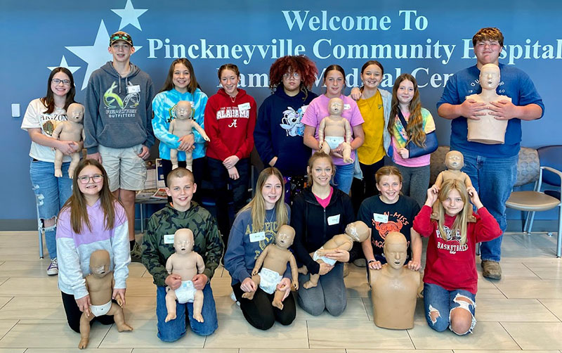 Graduates of the April 2023 Safe Sitter class at Pinckneyville Community Hospital pose with their practice babies.